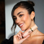 Woman holding a skincare product with a neutral background